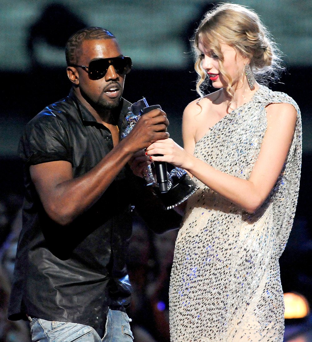 Kayne West jumps onstage as Taylor Swift accepts her award for the