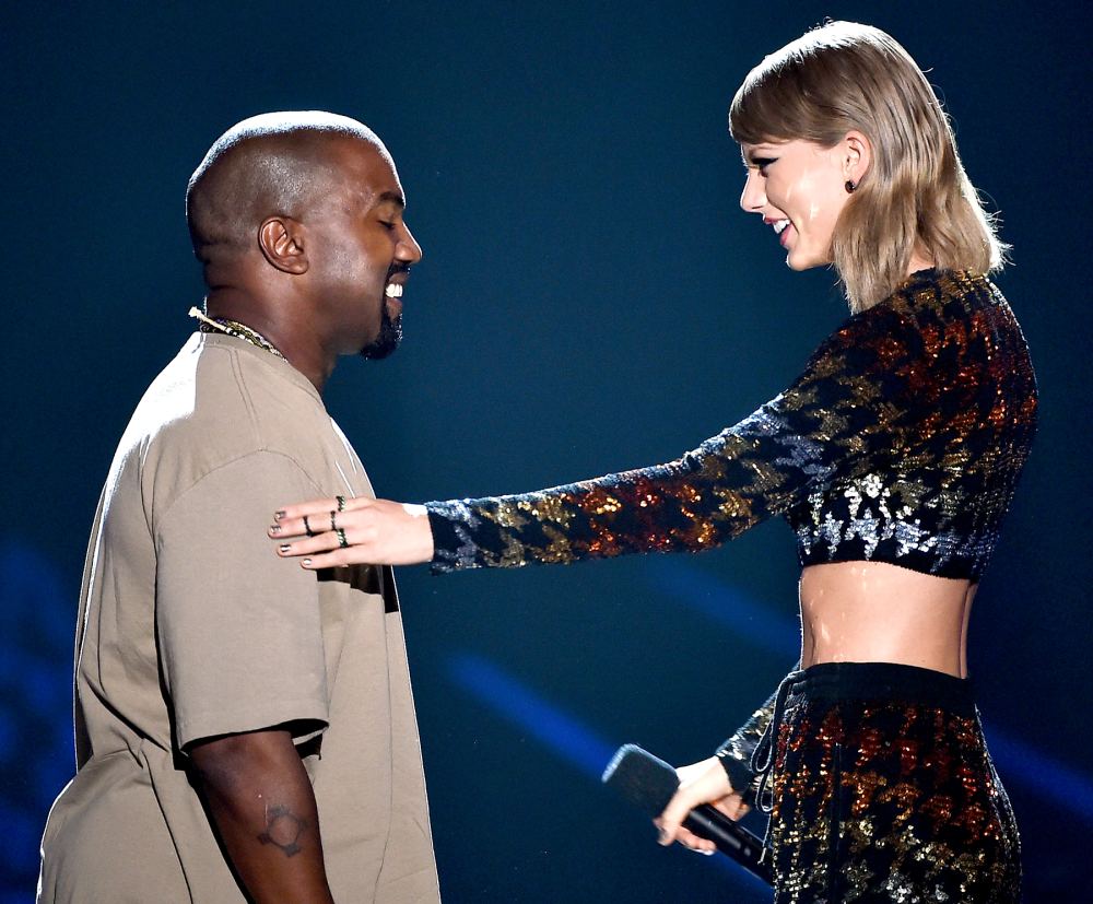 Kanye West accepts the Video Vanguard Award from recording artist Taylor Swift onstage during the 2015 MTV Video Music Awards.