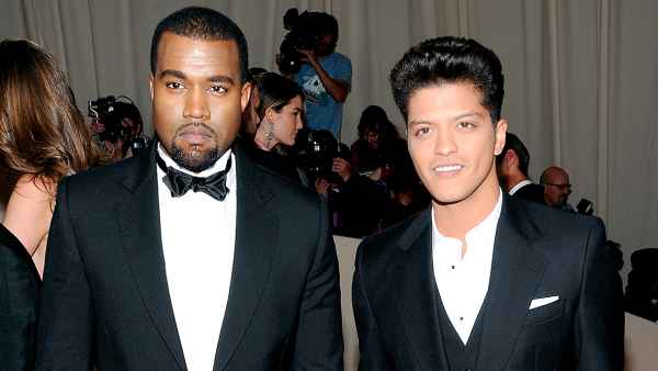 Kanye West, left, and Bruno Mars arrive at the Metropolitan Museum of Art Costume Institute gala benefit, celebrating the 'Alexander McQueen: Savage Beauty' exhibition, Monday, May 2, 2011 in New York.
