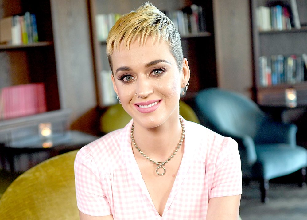 Katy Perry smiles for pictures during an interview in Berlin, Germany.