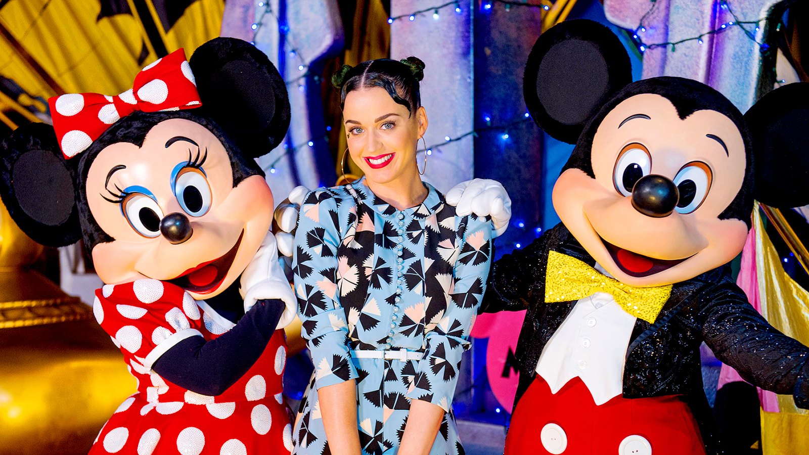 Katy Perry poses with Minnie Mouse and Mickey Mouse at Disney's Hollywood Studios at Walt Disney World Resort on July 4, 2014 in Lake Buena Vista, Florida.