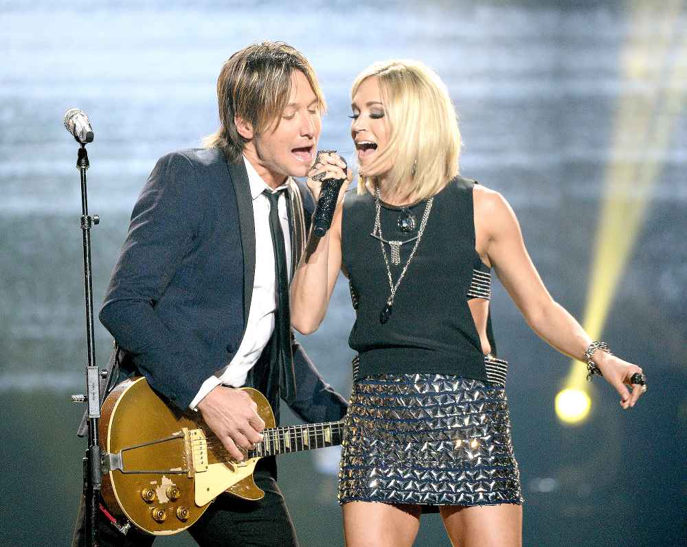 Keith Urban (L) and Carrie Underwood perform onstage during FOX's