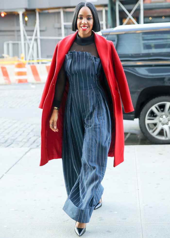 Kelly Rowland steps out in a fashionable outfit and a red coat over her shoulders in New York City.