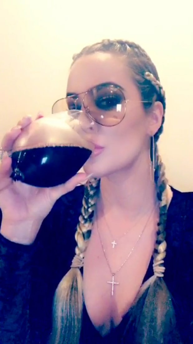 Khloe Kardashian shuts down pregnancy rumors by drinking a huge glass of wine