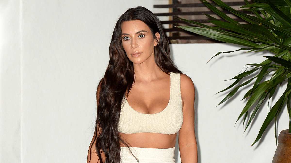 Kim Kardashian Wears a White Crop Top and Thong for Ad