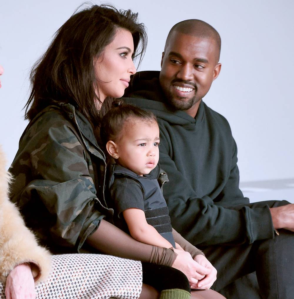 Kim Kardashian, North West and Kanye West attend the adidas show during Mercedes-Benz Fashion Week Fall 2015.