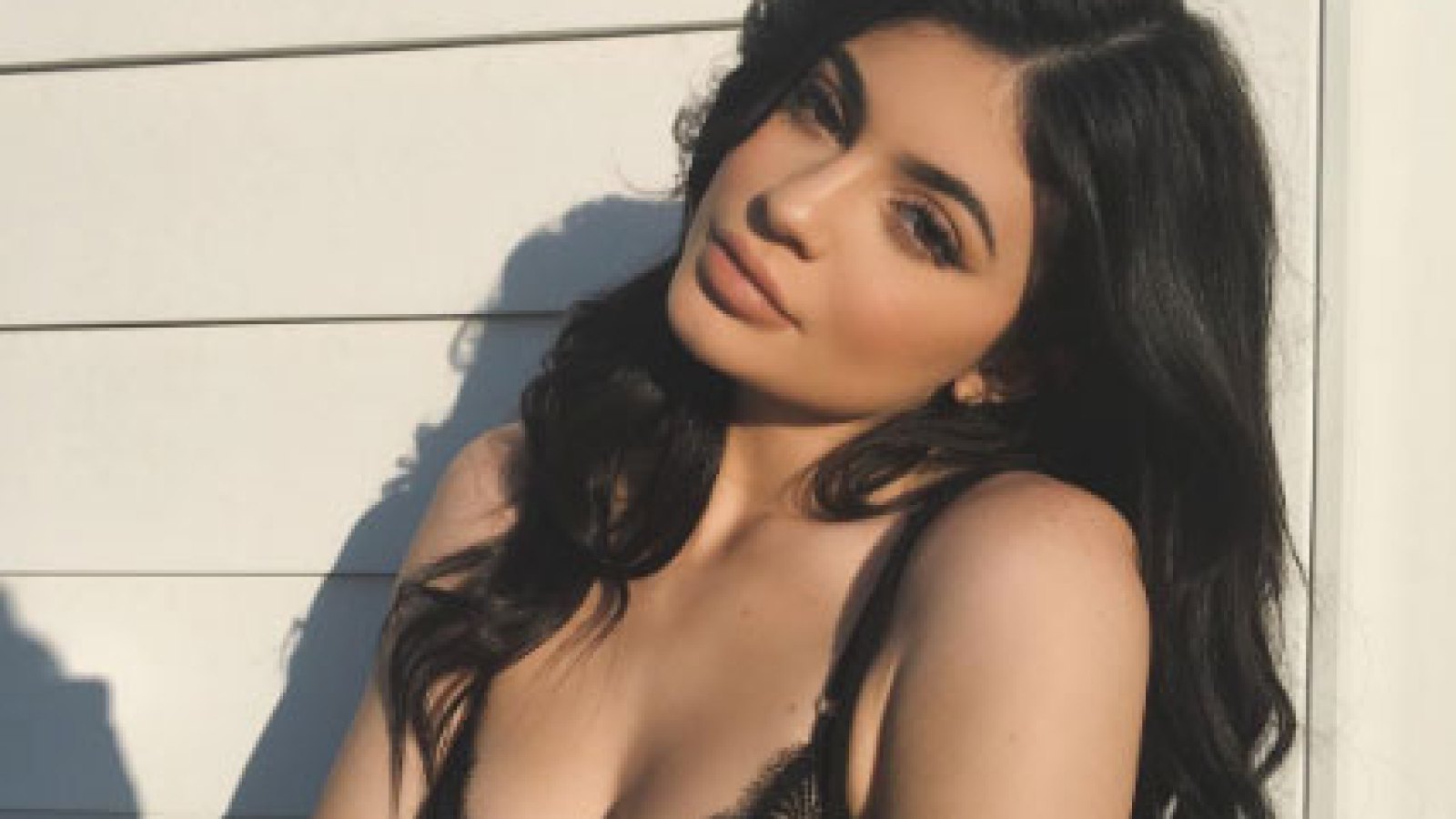 Kylie Jenner shows off her cleavage in a black lacy bra