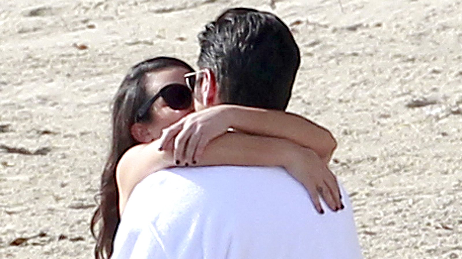 Lea Michele and John Stamos share a saucy seaside kiss whilst filming the season 2 finale of Scream Queens in Malibu.