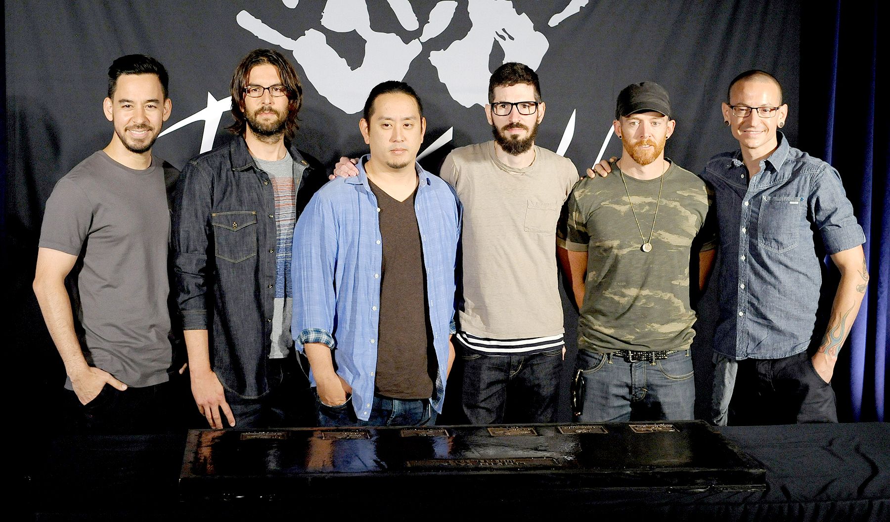 Mike Shinoda, Rob Bourdon, Joe Hahn, Brad Delson, Dave 'Phoenix' Farrell and Chester Bennington of Linkin Park are inducted into the Rockwalk at Guitar Center on June 18, 2014 in Hollywood, California.