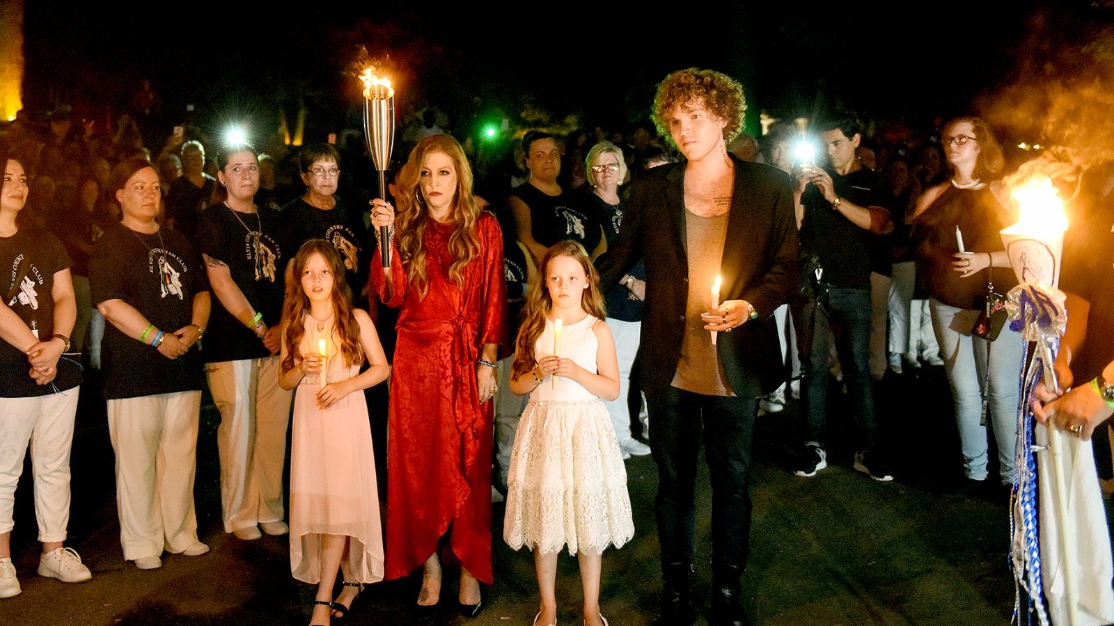 On the 40th anniversary of his passing, Harper Lockwood, Lisa Marie Presley, Finley Lockwood, and Ben Keough joined over 50 thousand people for the candlelight vigil at Graceland, in honor of Elvis.