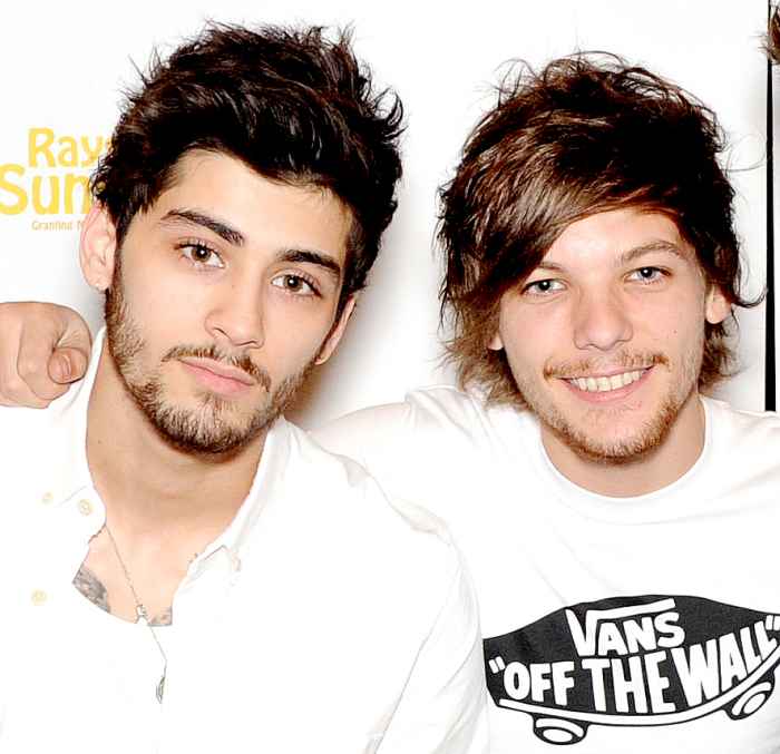 Zayn Malik and Louis Tomlinson pose for photographs at Wembley Arena as they made the wishes of 60 seriously ill children come true and met the children prior to performing at Wembley Stadium on June 8, 2014 in London, United Kingdom.
