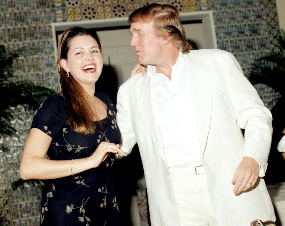 During an event at the Mar-a-Lago estate, Venezuelan beauty pageant winner (and later actress and television personality), 1996 Miss Universe Alicia Machado laughs with American businessman Donald Trump, Palm Beach, Feb. 16, 1997.
