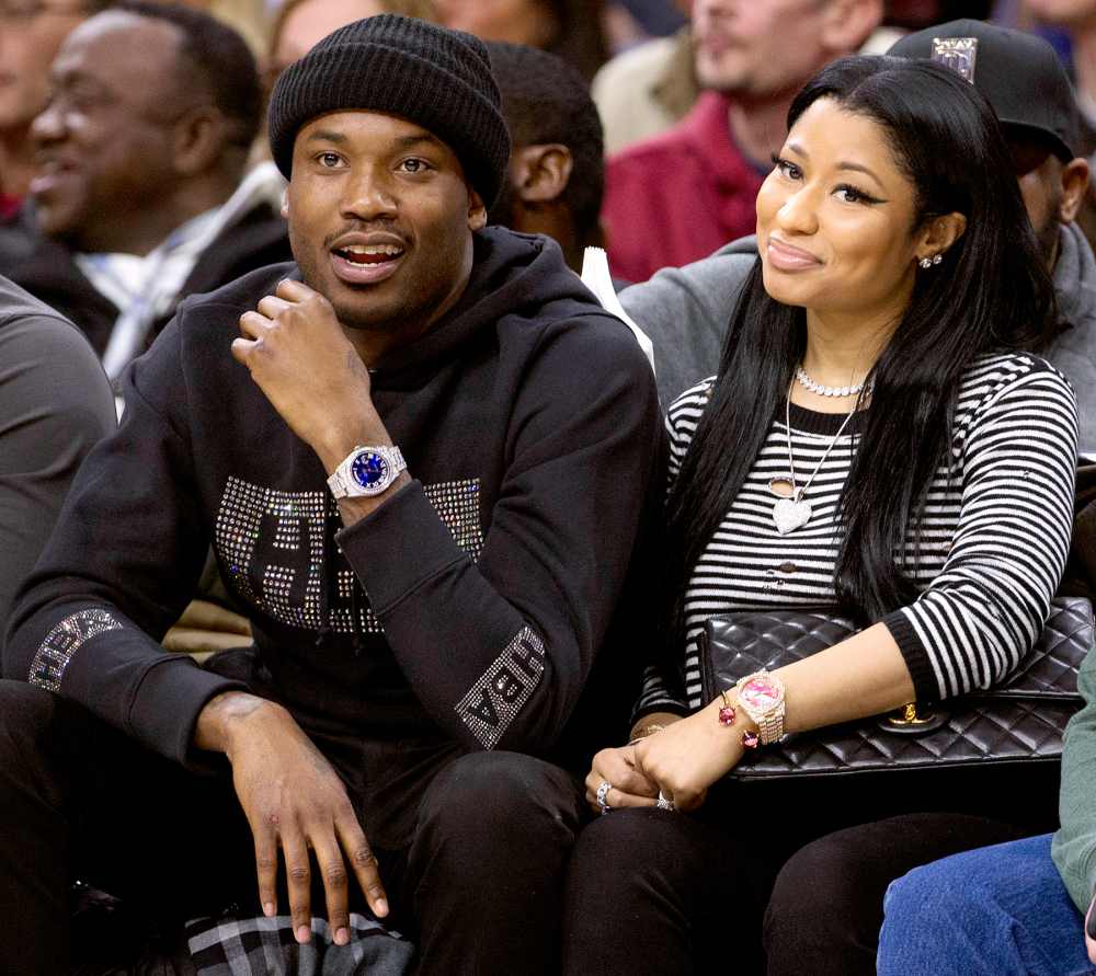 Meek Mill and Nicki Minaj watch the game between the Golden State Warriors and Philadelphia 76ers on January 30, 2016 at the Wells Fargo Center in Philadelphia, Pennsylvania.