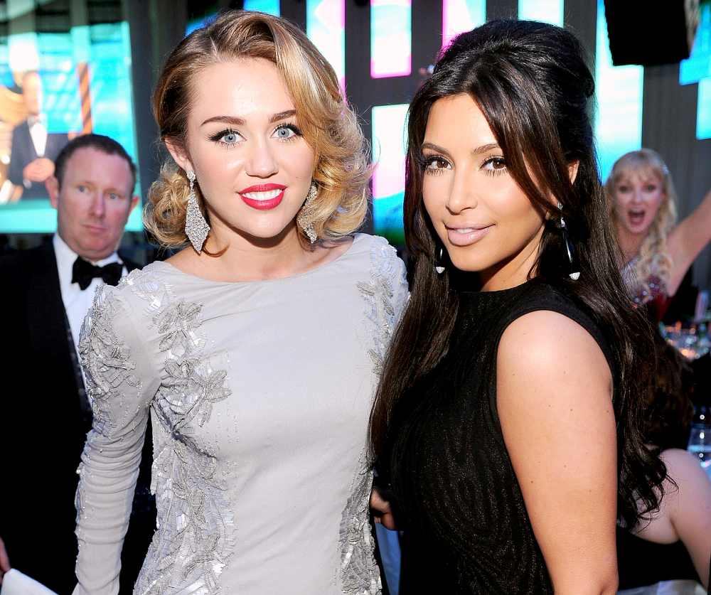 Miley Cyrus and Kim Kardashian attend the 20th Annual Elton John AIDS Foundation Academy Awards Viewing Party at The City of West Hollywood Park on February 26, 2012.