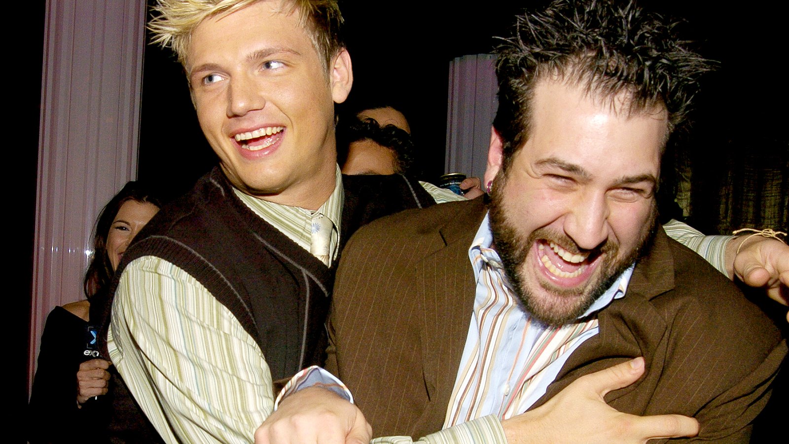 Nick Carter pushes Joey Fatone out of a Backstreet Boys interview in Backstage Creations Talent Retreat at Motown 45 Special in 2004.