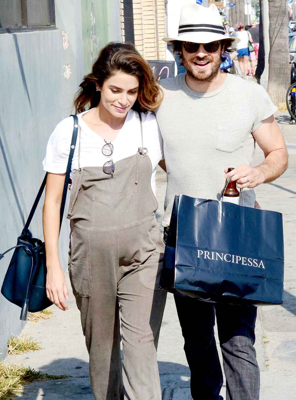 Ian Somerhalder and Nikki Reed walk along Abbot Kinney Boulevard in Venice, CA on July 9, 2017.