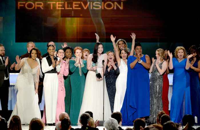The cast of 'Orange Is the New Black,' including actors Vicky Jeudy, Lori Petty, Uzo Aduba, Kate Mulgrew, Annie Golden, Laura Prepon, Dale Soules, Laverne Cox, and Michelle Hurst, accept Outstanding Performance by an Ensemble in a Comedy Series award onstage during the 22nd Annual Screen Actors Guild Awards.