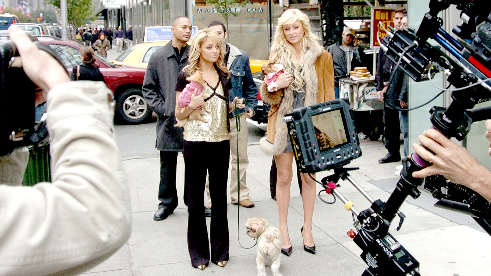 Nicole Richie (left), Paris Hilton and their pups are on camera at Park Ave. and 55th St. as they film a scene for their TV series "Simple Life."