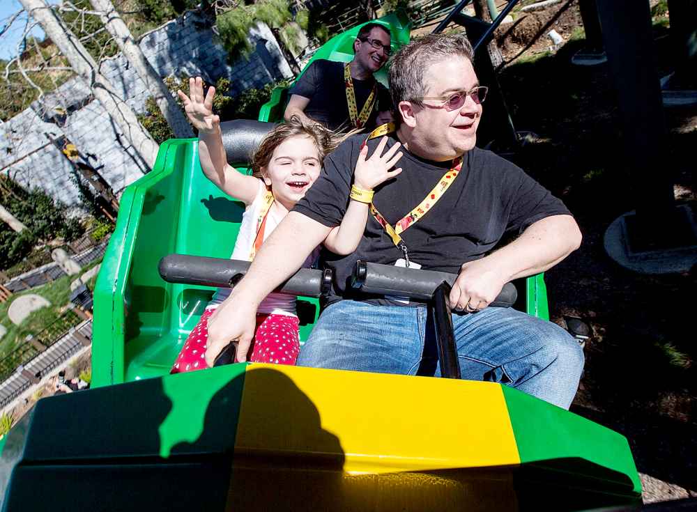 Patton Oswalt and his daughter Alice Oswalt ride The Dragon roller coaster at LEGOLAND on February 6, 2016 in Carlsbad, California.