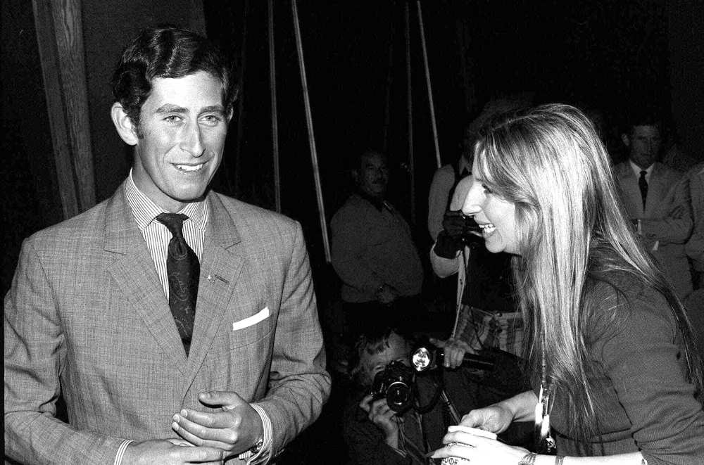 Barbra Streisand offers a cup of coffee to Prince Charles of Great Britain as they chatted on a set at Warner Bros. studio in Los Angeles, Calif. March 19, 1974.