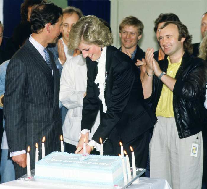 Diana, Princess of Wales and Prince Charles, Prince of Wales cutting a cake to celebrate ten years of the Prince's Trust Concert at Wembley, The singer and musician Phil Collins is standing on Diana's left