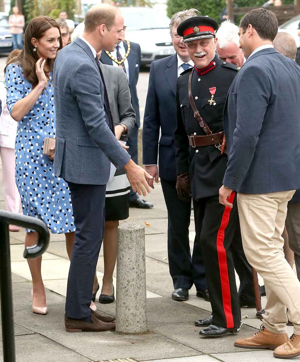 Catherine, Duchess of Cambridge and Prince William, Duke of Cambridge helped up Johnathen Douglas Hughes after he fell over during there visit at Stewards Academy on September 16, 2016 in Harlow, England.