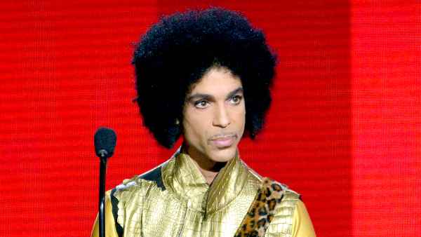 Prince speaks onstage during the 2015 American Music Awards.