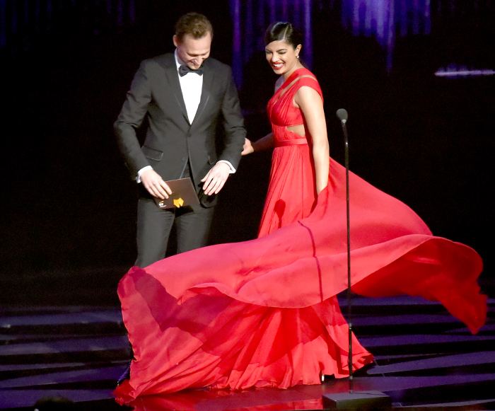 Tom Hiddleston and Priyanka Chopra speak onstage during the 68th Annual Primetime Emmy Awards.