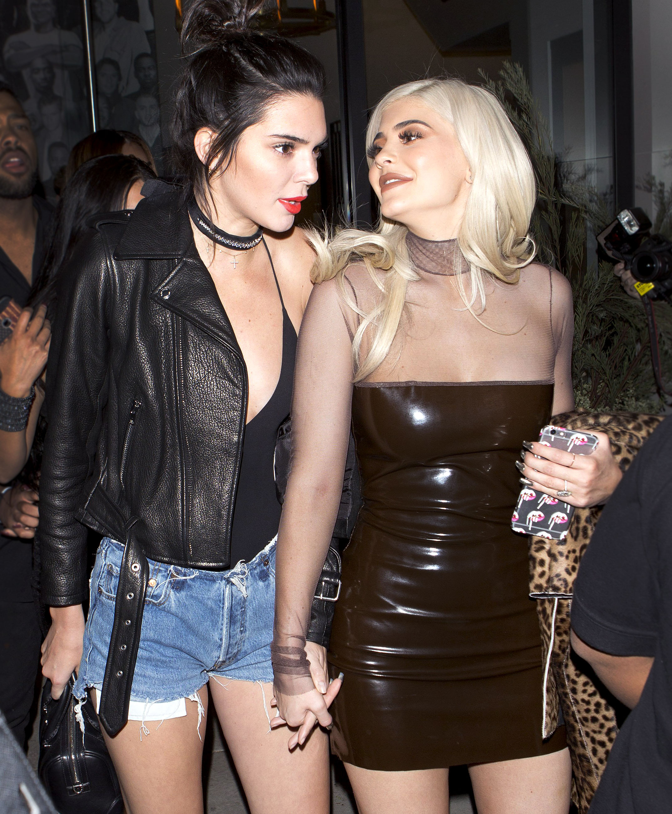 kendall jenner looks stunning in a brown vinyl outfit while