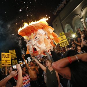 Protesters burn an effigy of Donald Trump outside Los Angeles City Hall.