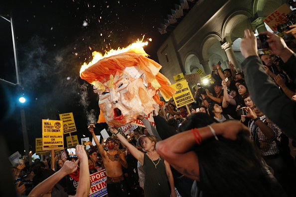 Protesters burn an effigy of Donald Trump outside Los Angeles City Hall.