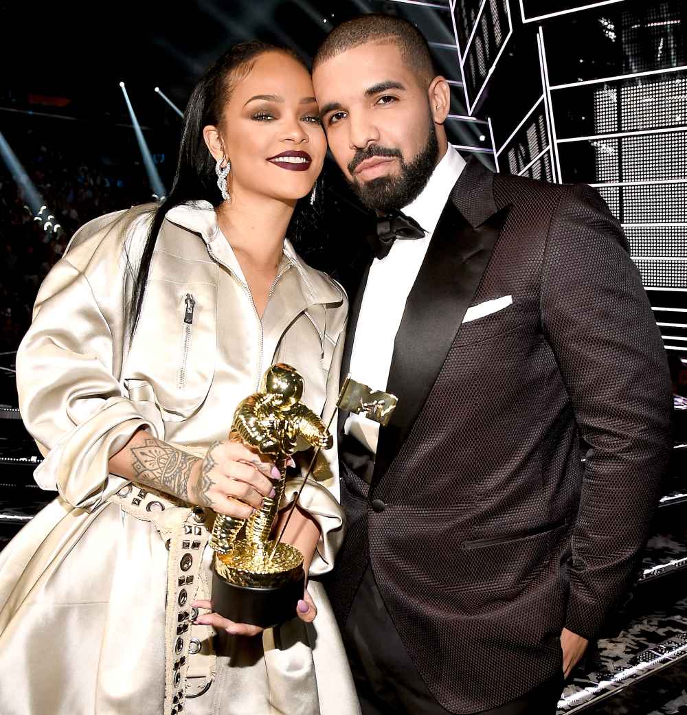Rihanna and Drake pose onstage during the 2016 MTV Video Music Awards.
