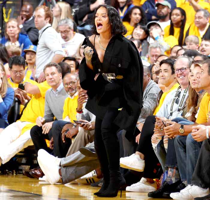 Rihanna cheers from the side line during the game of the Golden State Warriors and the Cleveland Cavaliers in Game One of the 2017 NBA Finals on June 1, 2017 at ORACLE Arena in Oakland, California.