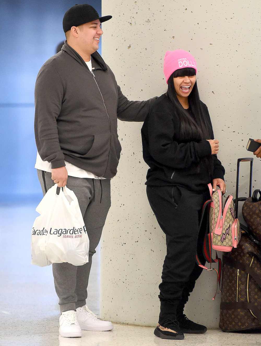 Rob Kardashian and Blac Chyna arrive at JFK airport in NYC.