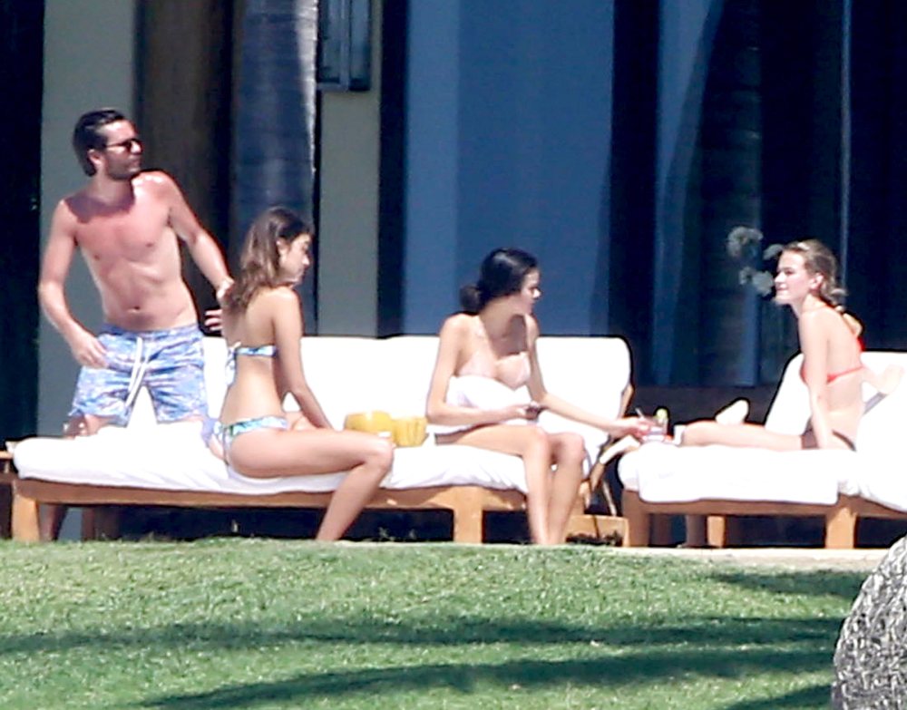 Scott Disick is seen drinking and partying with a group of females while on vacation with 'Girls Gone Wild' founder Joe Francis and his girlfriend Abbey Wilson in Mexico on March 2, 2016.