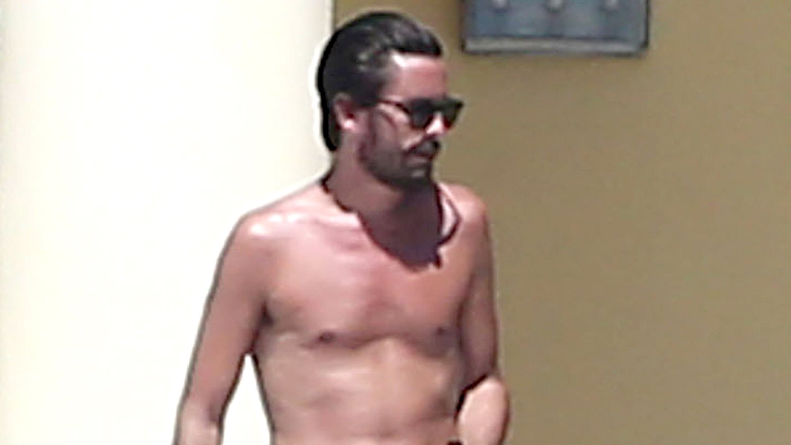 Scott Disick is seen drinking and partying with a group of females while on vacation with 'Girls Gone Wild' founder Joe Francis and his girlfriend Abbey Wilson in Mexico on March 2, 2016.