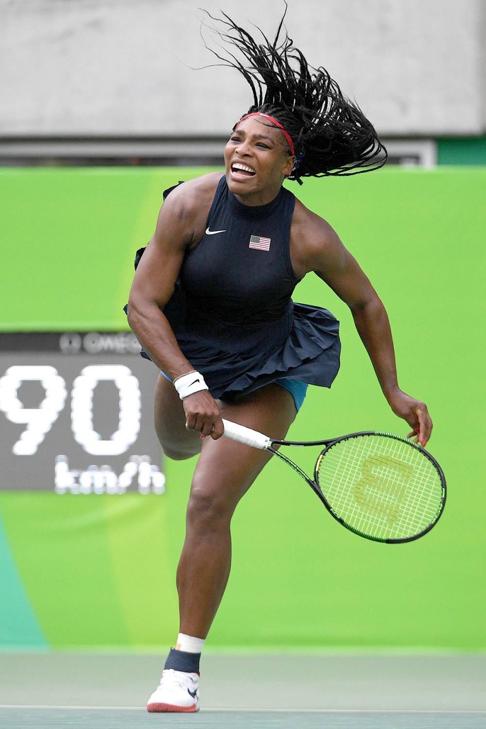 USA's Serena Williams returns the ball to Australia's Daria Gavrilova during their women's first round singles tennis match at the Olympic Tennis Centre of the Rio 2016 Olympic Games in Rio de Janeiro on August 7, 2016.