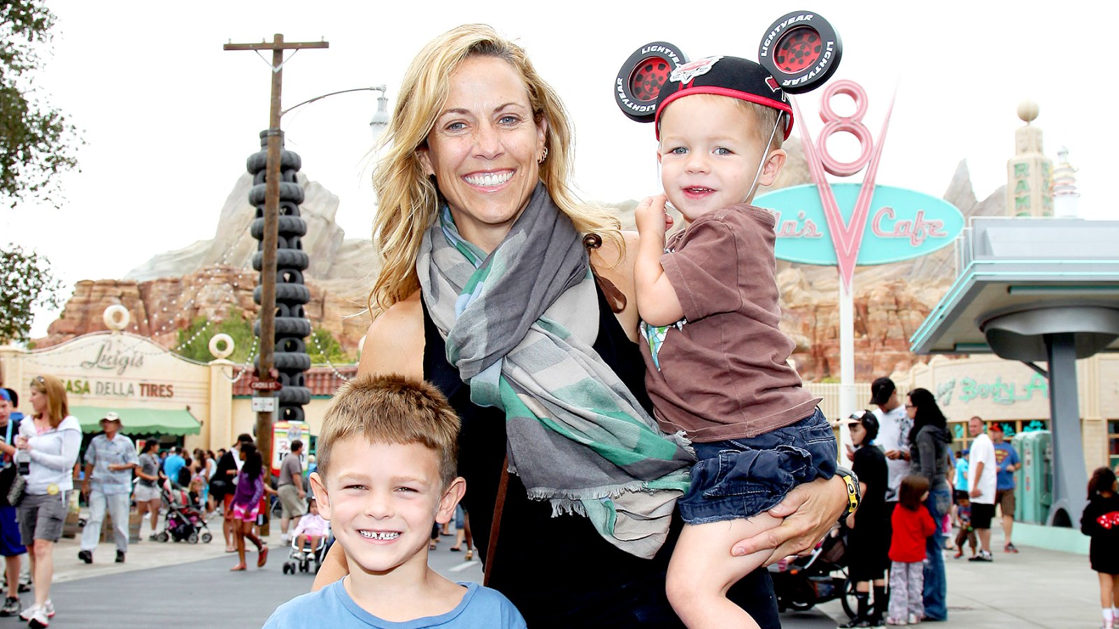 Sheryl Crow and her sons, Wyatt, 5 (left) and Levi, 2, pose at Cars Land in Disney California Adventure park on July 25, 2012 in Anaheim, California.
