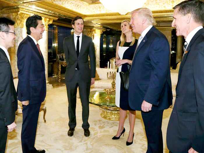 Japanese Prime Minister Shinzo Abe, second from left, chats with U.S. President-elect Donald Trump, second from right, during a meeting as Ivanka Trump, third from right, the oldest daughter of Donald Trump, and her husband, Jared Kushner.