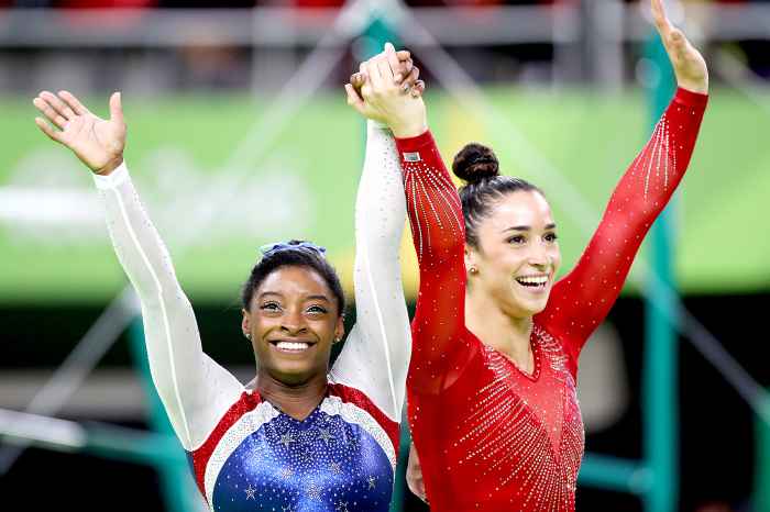 Simone Biles of the United State and Alexandra Raisman of the United States celebrate after winning Gold and Silver during the Artistic Gymnastics Women's Individual All-Around Final at the Rio Olympic Arena on August 11, 2016 in Rio de Janeiro, Brazil.