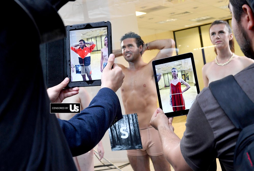 Spencer Matthews poses in a shop window to launch Lyst's augmented reality dressing experience on September 16, 2016 in London, England.