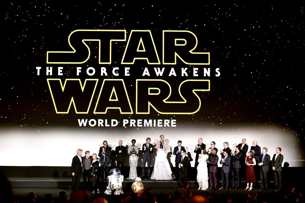 The cast and crew speak onstage during the World Premiere of Star Wars: The Force Awakens.