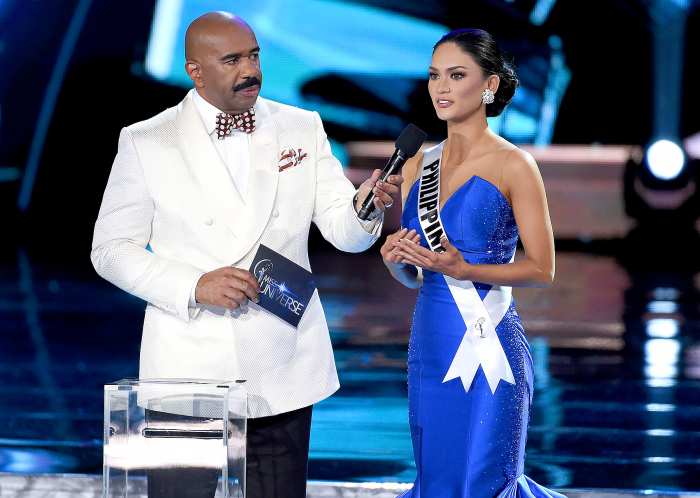 Host Steve Harvey listens as Miss Philippines 2015, Pia Alonzo Wurtzbach, answers a question during the interview portion of the 2015 Miss Universe Pageant at The Axis at Planet Hollywood Resort & Casino on December 20, 2015 in Las Vegas, Nevada.