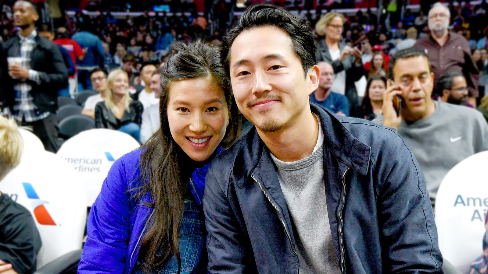 Steven Yeun (R) and Joana Pak attend a basketball game between the Detroit Pistons and the Los Angeles Clippers at Staples Center on November 7, 2016 in Los Angeles, California.