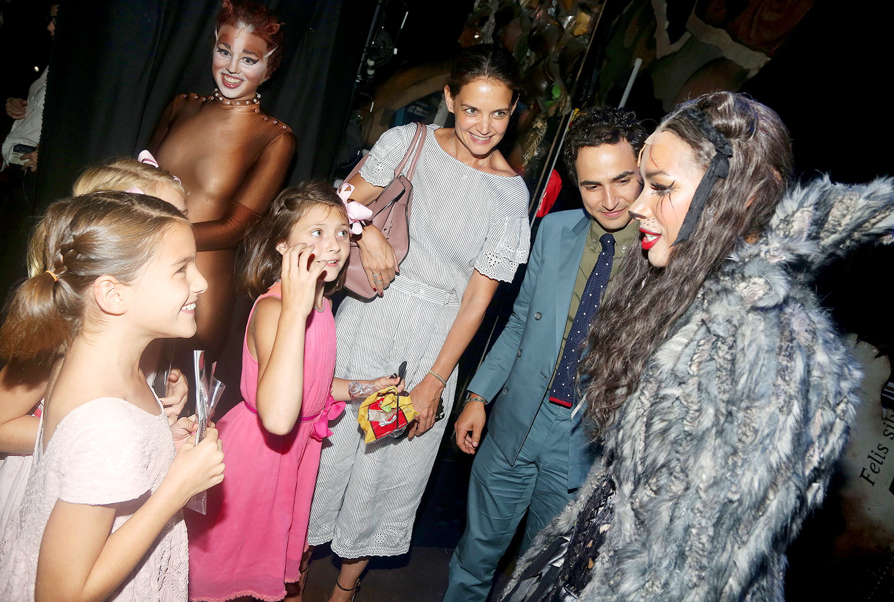 Suri Cruise, guest, Emily Pynenberg as "Cassandra", Katie Holmes, Zac Posen, Leona Lewis as "Grizabella The Glamour Cat" chat backstage at the hit musical "Cats" on Broadway at The Neil Simon Theatre on August 16, 2016 in New York City.