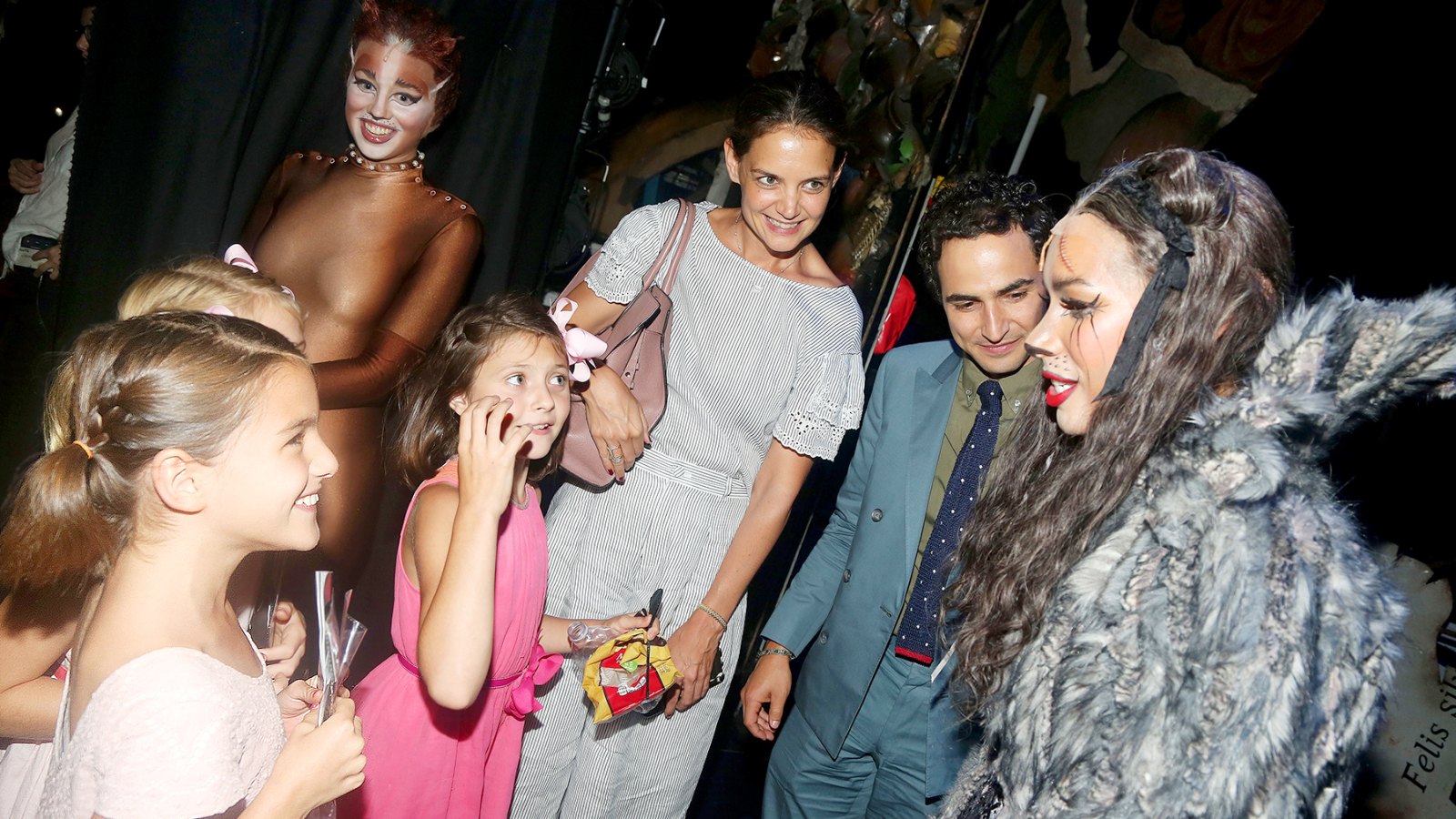 Suri Cruise, guest, Emily Pynenberg as "Cassandra", Katie Holmes, Zac Posen, Leona Lewis as "Grizabella The Glamour Cat" chat backstage at the hit musical "Cats" on Broadway at The Neil Simon Theatre on August 16, 2016 in New York City.