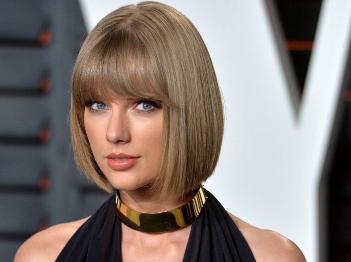 Eddie Redmayne has denied dating Taylor Swift