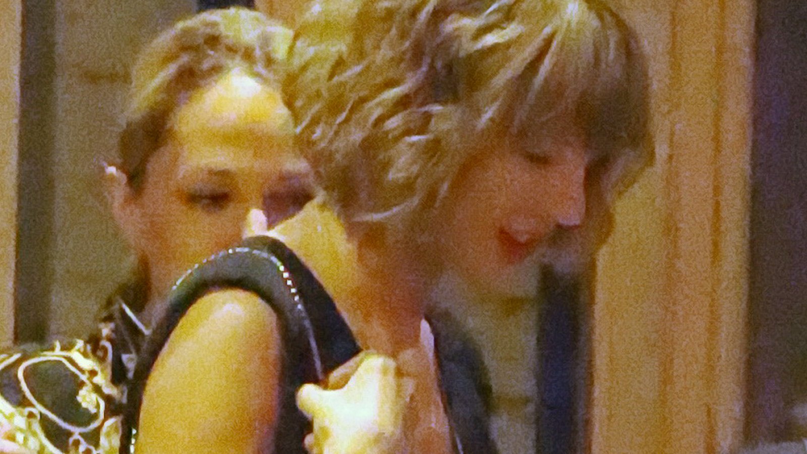 Taylor Swift wears a gold heart shaped locket necklace following her one year anniversary with boyfriend Calvin Harris.
