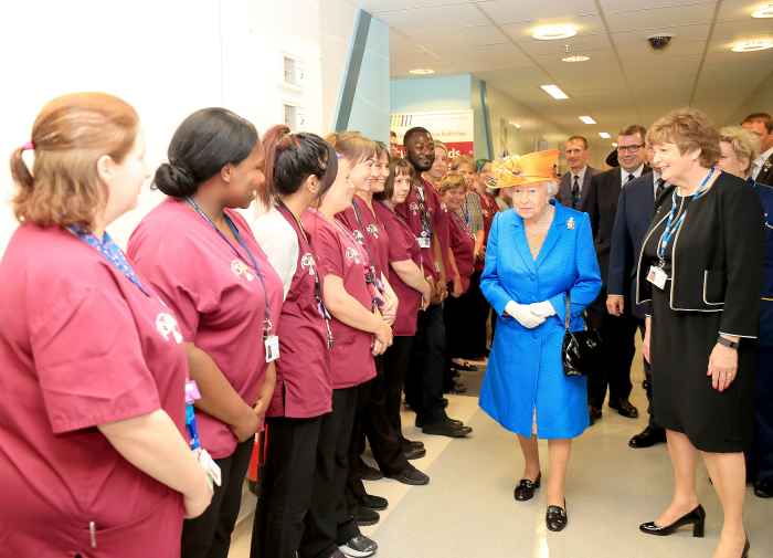 Escorted by Kathy Cowell (right) Chairman of the Central Manchester University Hospital, Queen Elizabeth II visits the Royal Manchester Children's Hospital on May 25, 2017 in Manchester, England. Queen Elizabeth visited the hospital to meet victims of the Manchester Arena terror attack and to thank members of staff who treated them.