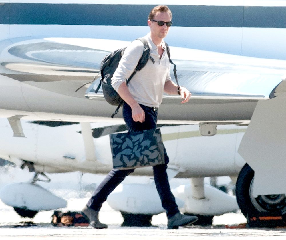 Tom Hiddleston is spotted boarding a private airplane in Los Angeles.
